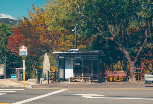 Bus stop sign in a quaint village along the Rousseau trail.