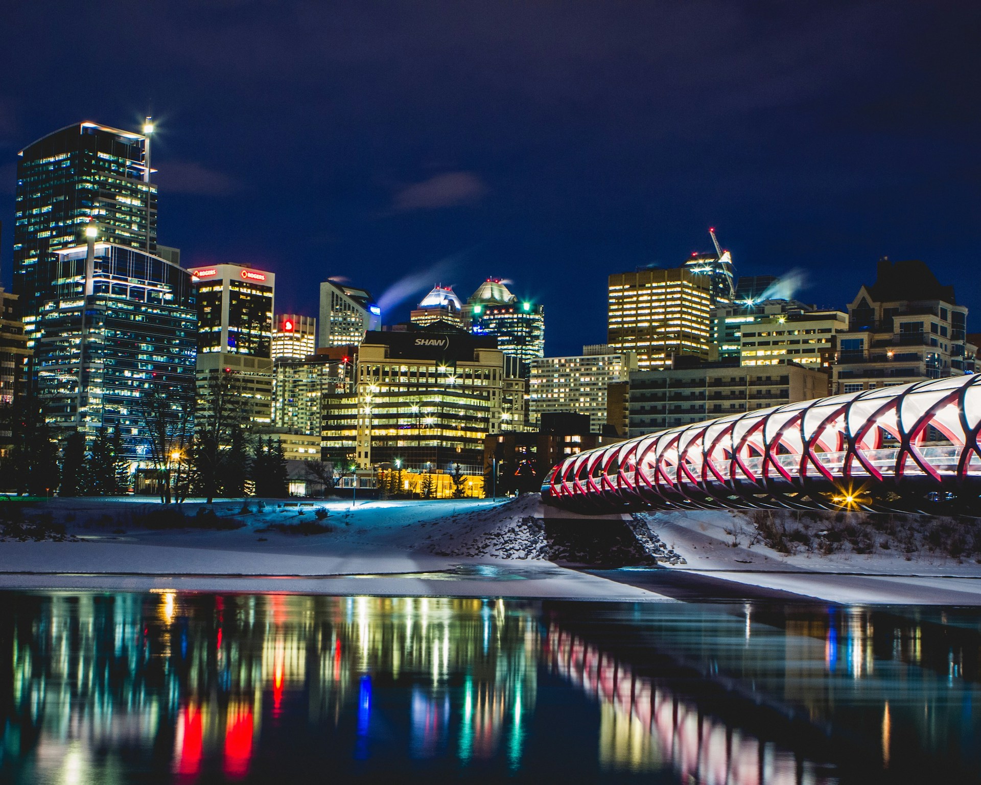 a view of a city at night from across the river