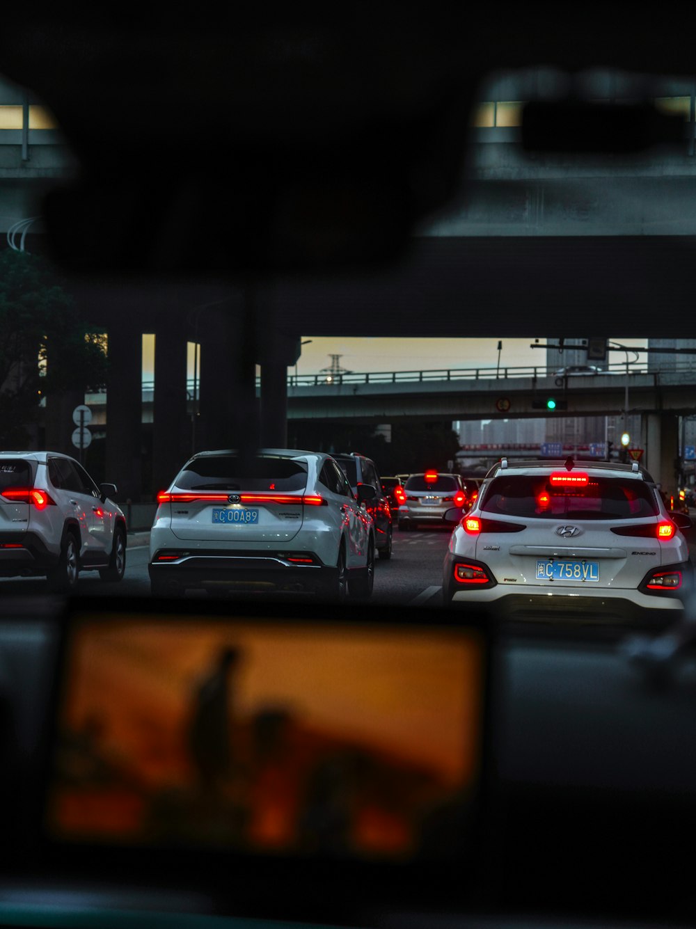 a group of cars that are sitting in the street