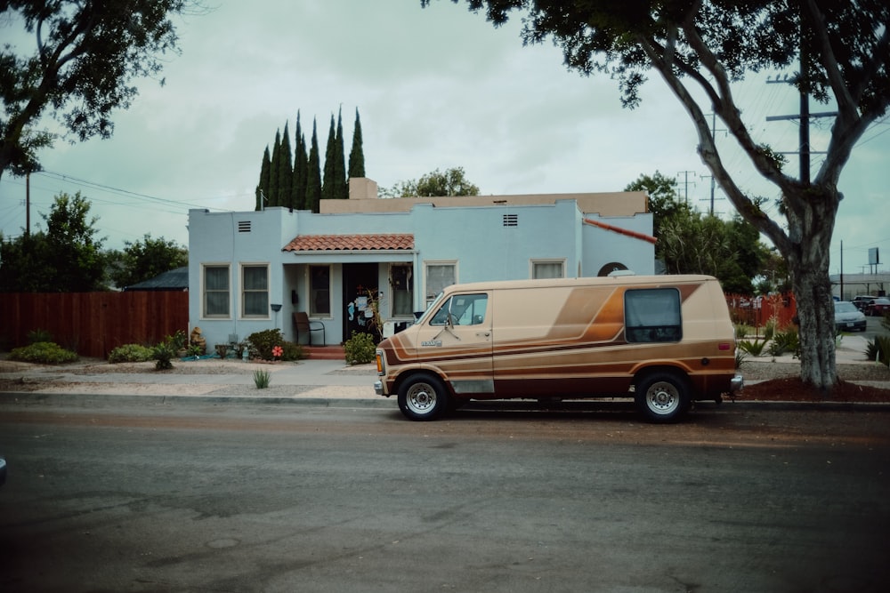 a van parked in front of a house