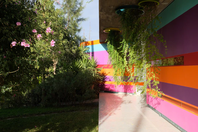 Close-up of a vibrant Vertilux wall print featuring a blend of urban and natural motifs in a modern office.