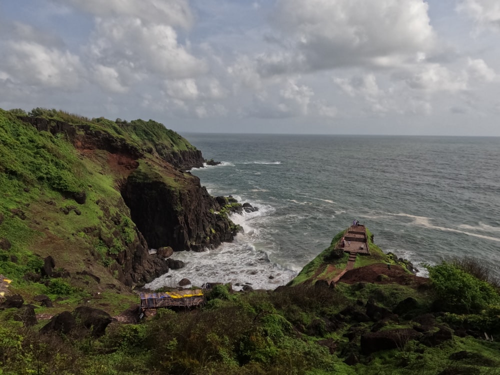 a view of the ocean from the top of a hill