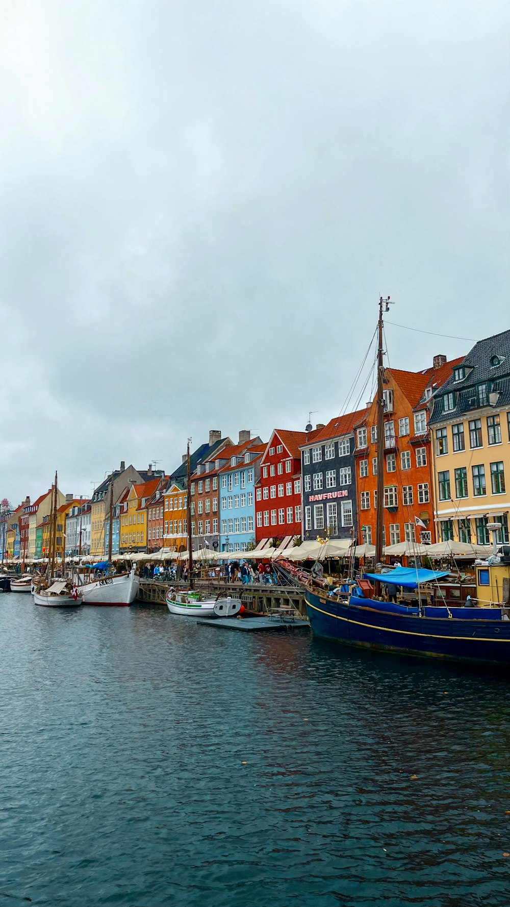 a row of colorful buildings next to a body of water