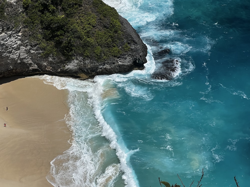 an aerial view of a beach and a cliff