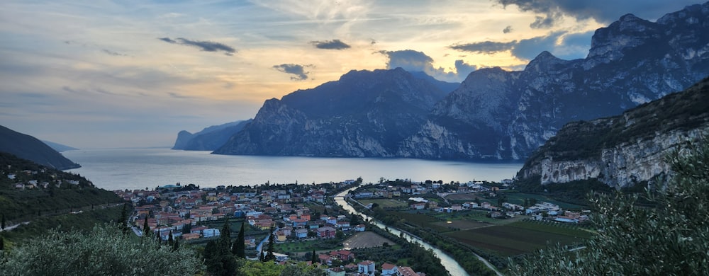 a scenic view of a town and a body of water