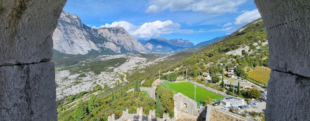 a view of a valley from a window in a castle