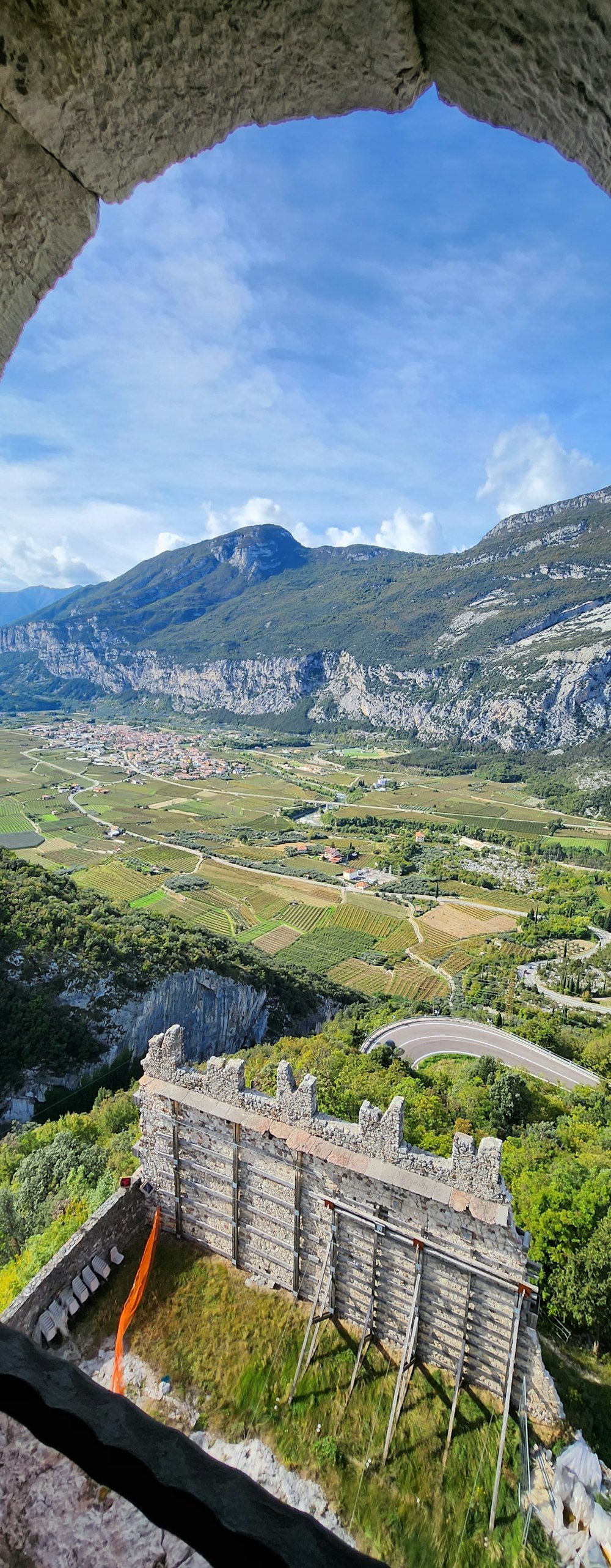 a view of a valley from a window in a castle