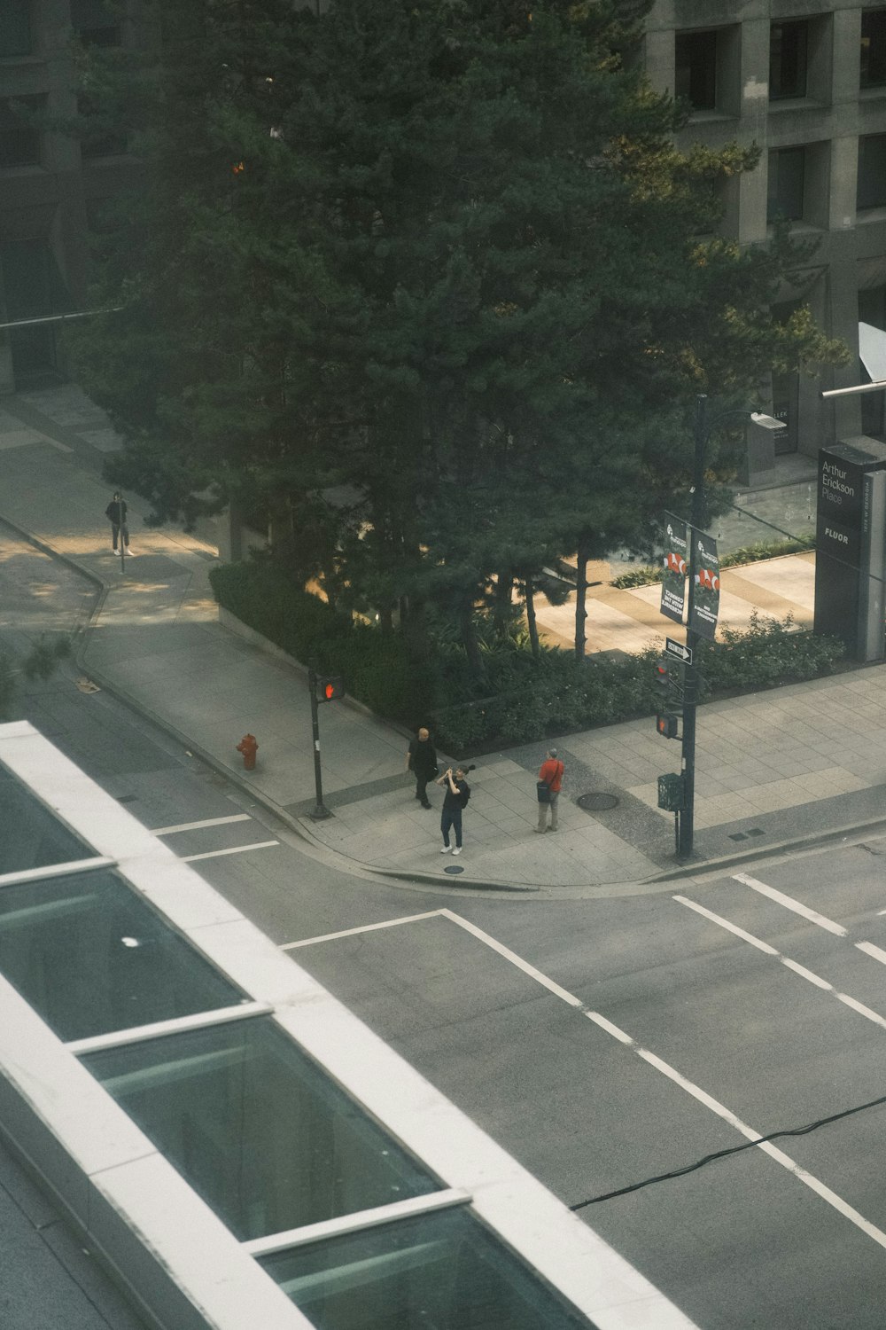 a couple of people walking across a street