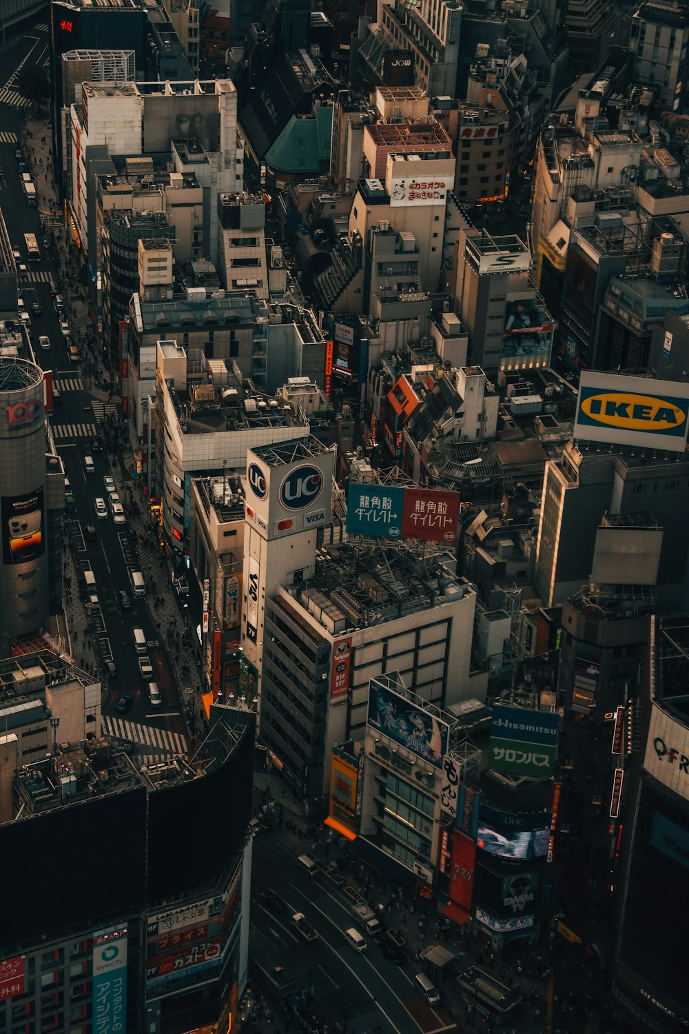 an aerial view of a city with lots of tall buildings