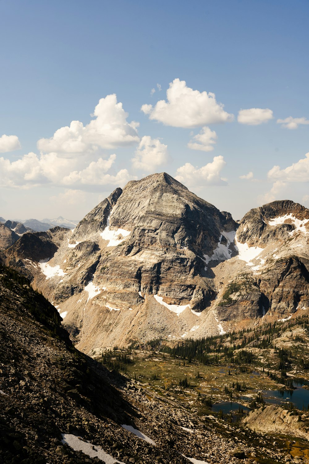 a view of a mountain range with snow on it