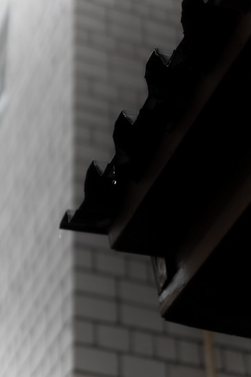 A close-up of waterproofing material being applied to a wall.