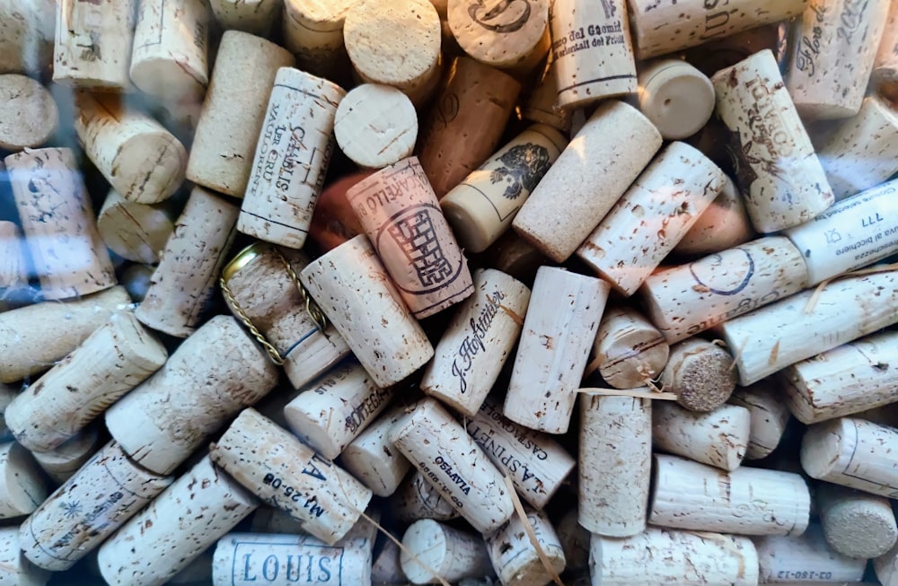 a bunch of wine corks are stacked together