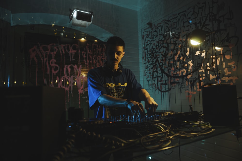 a dj mixing music in a dark room