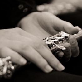 a close up of a person holding a remote control