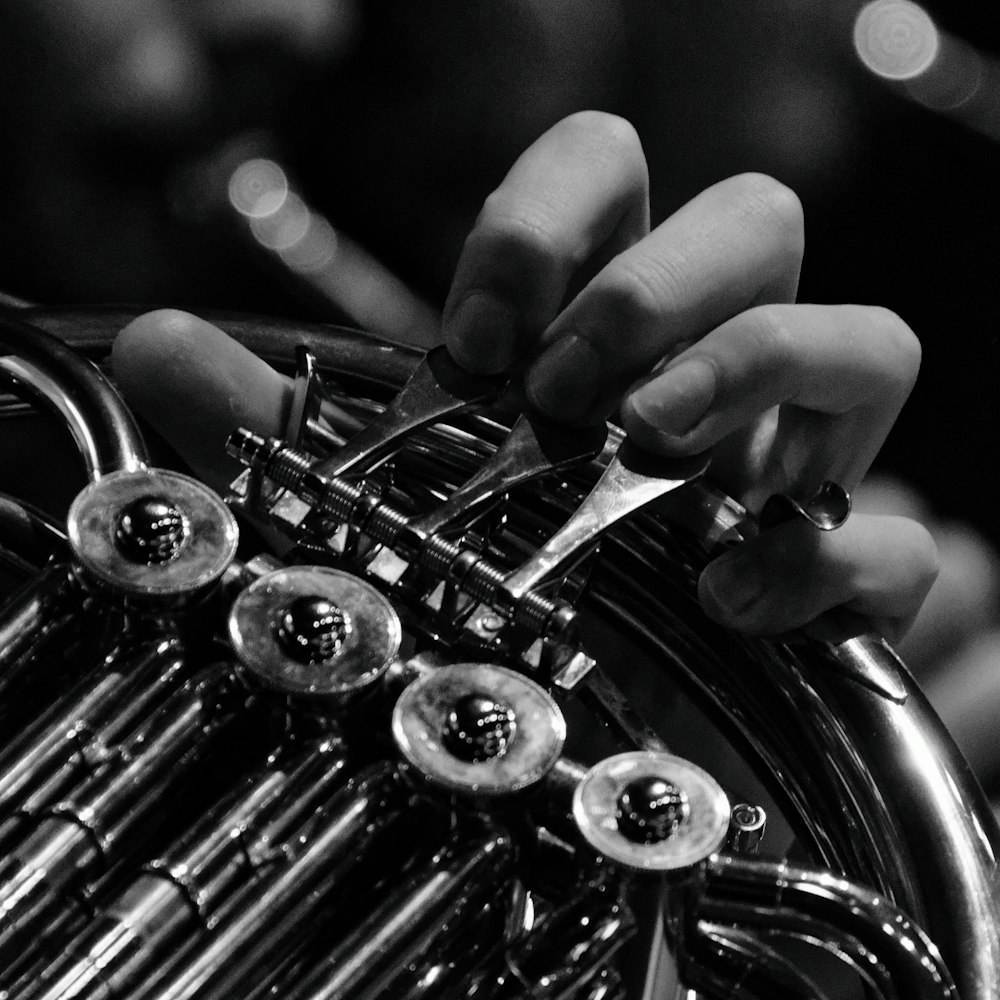 a close up of a person playing a trumpet