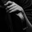 a close up of a person holding a violin