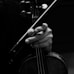 a close up of a person playing a violin