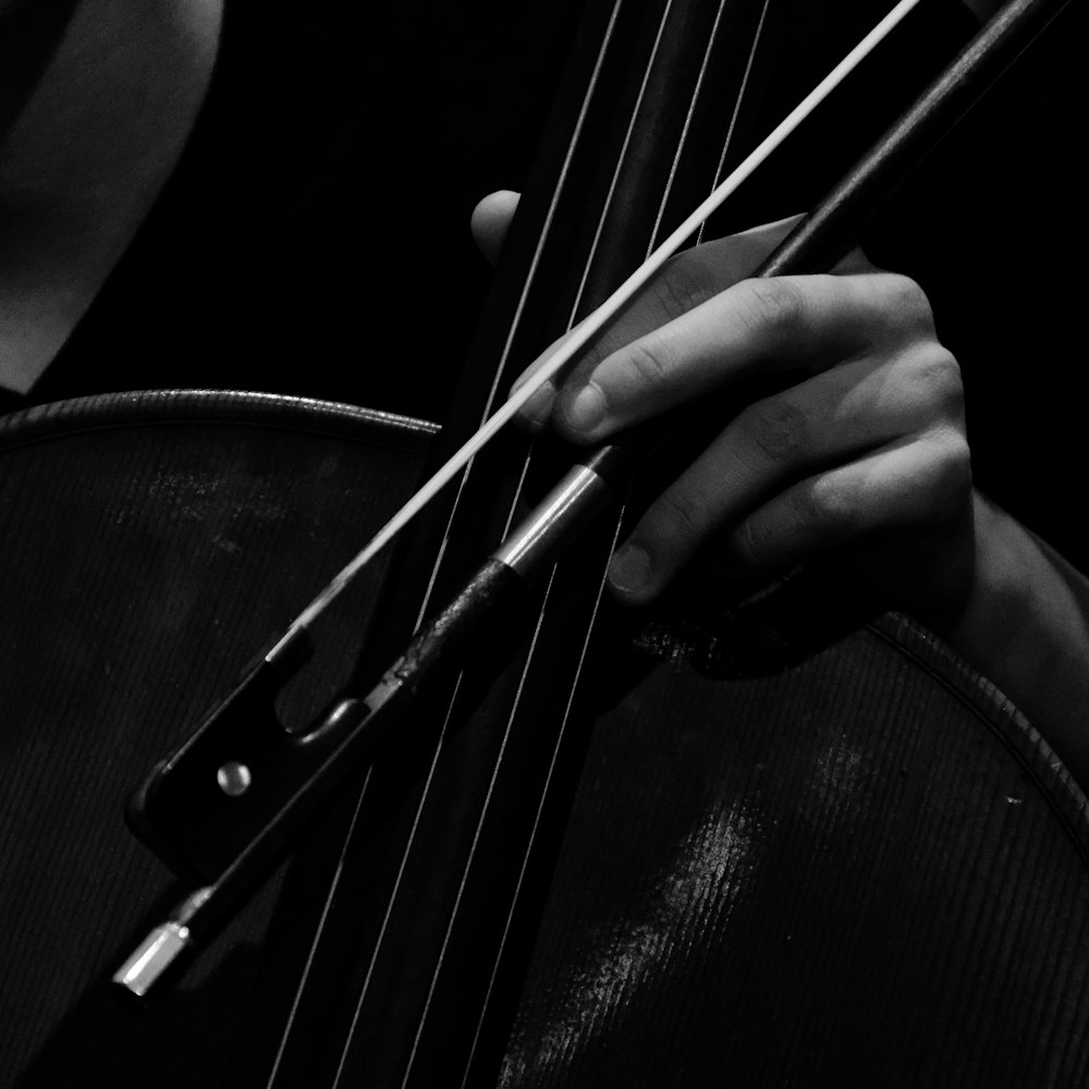 a close up of a person playing a violin