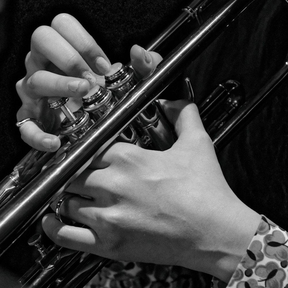 a close up of a person playing a trumpet