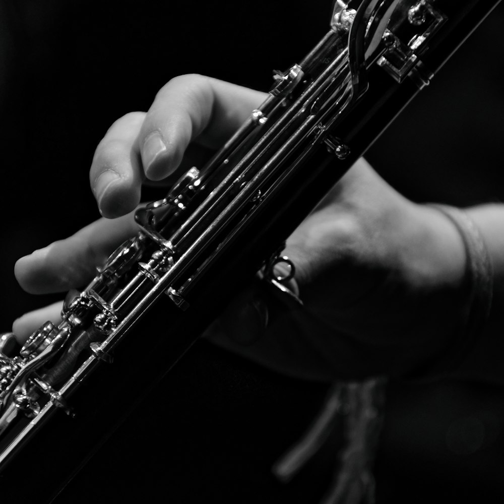 a close up of a person playing a musical instrument