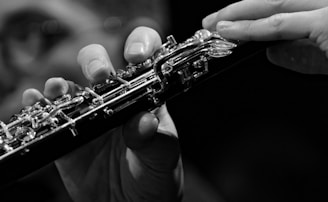 a close up of a person playing a flute