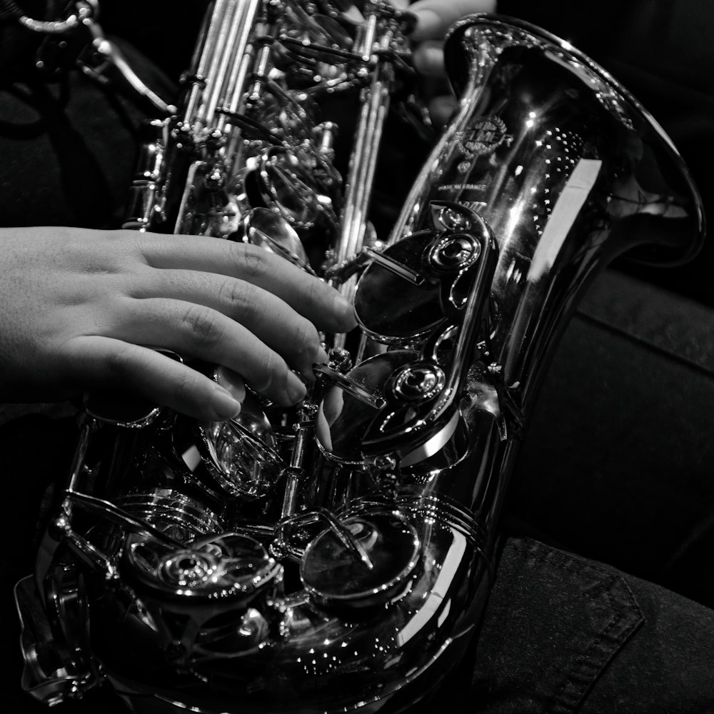 a person playing a saxophone on a couch