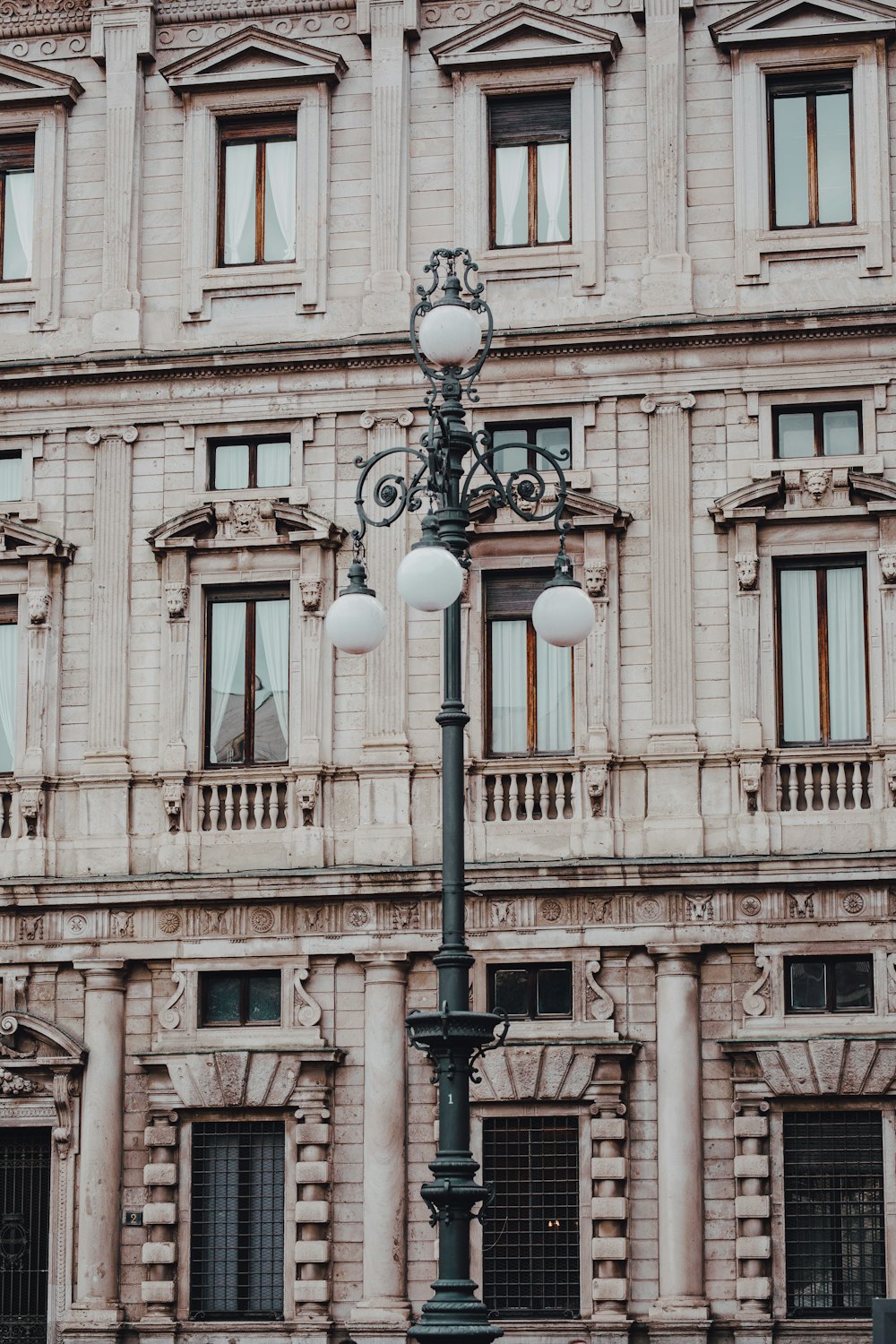 a street light in front of a tall building