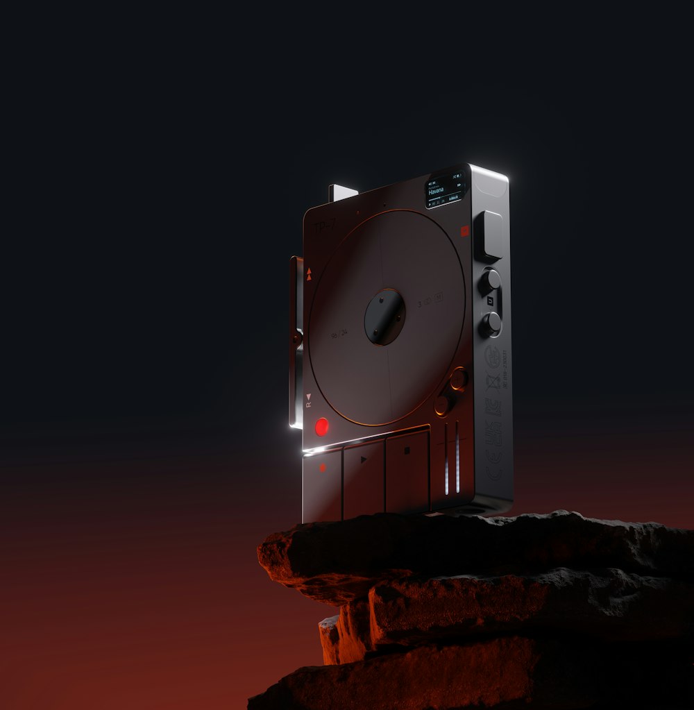 a red disk drive sitting on top of a rock