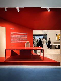 Creative workspace with red and black color accents, showcasing marketing materials for healthcare clients