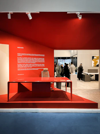 A vibrant office space with red and white accents reflecting the company colors.