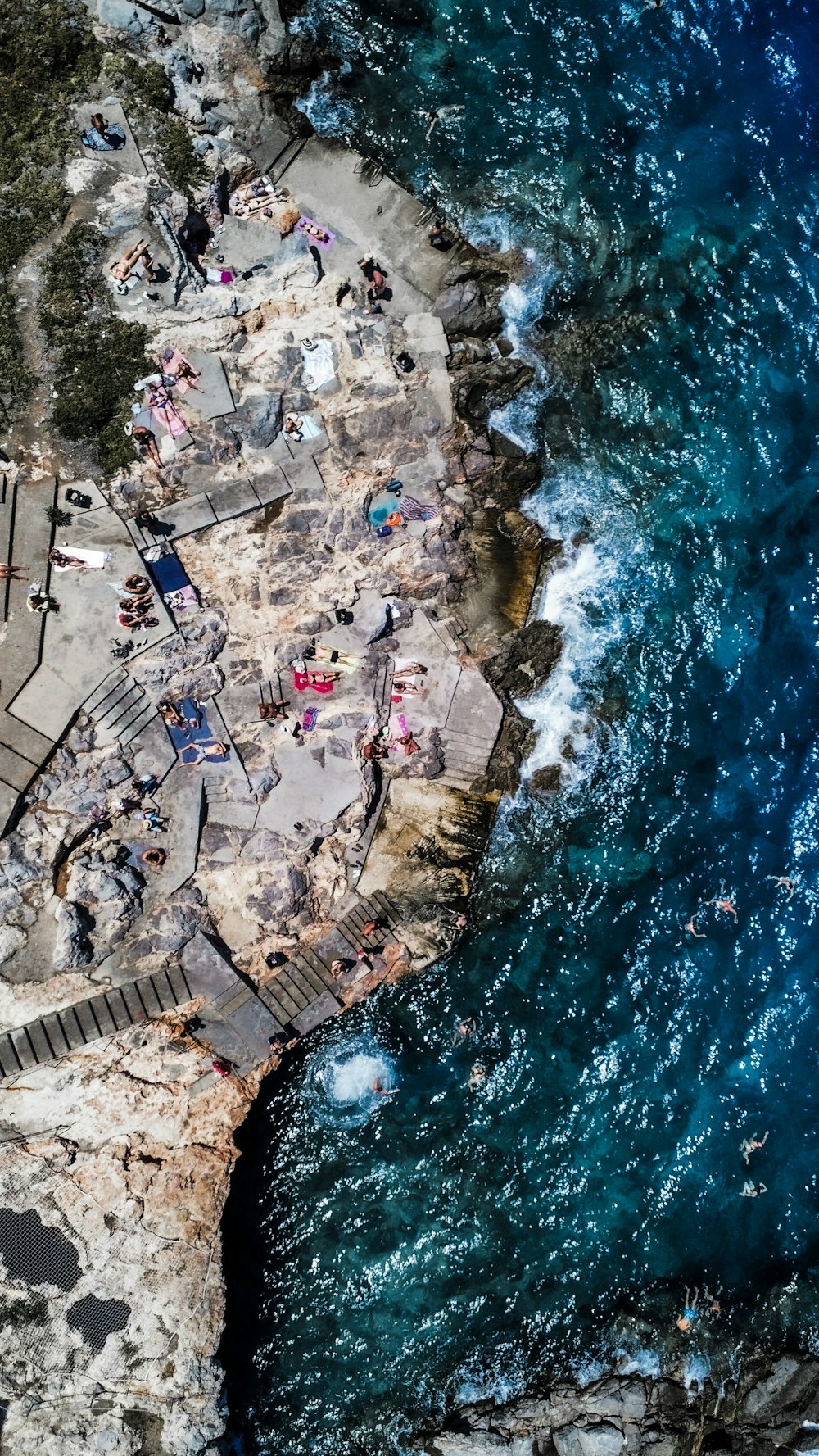 an aerial view of a beach with people on it