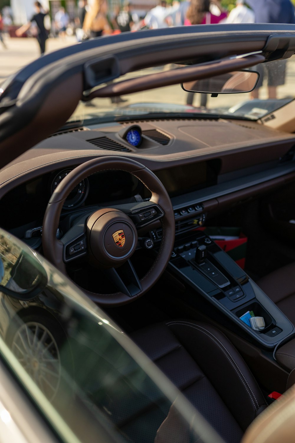 a close up of a car dashboard with a steering wheel