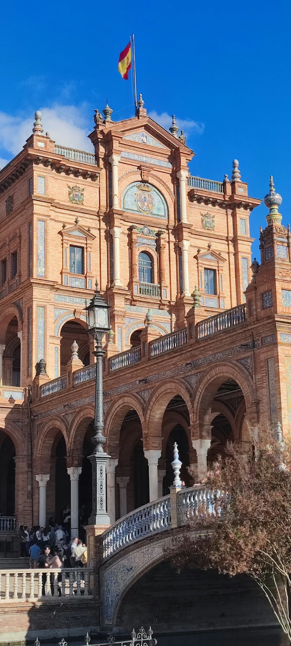 a large building with a bridge in front of it