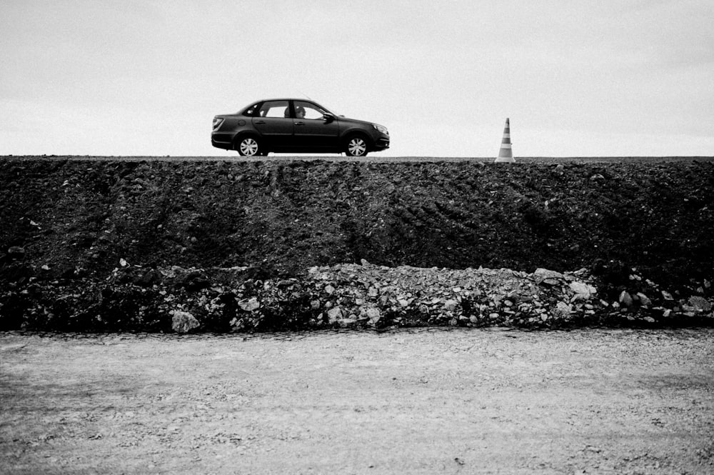 a car is parked on top of a wall