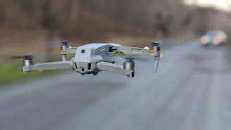 A drone monitoring traffic flow on a busy road.