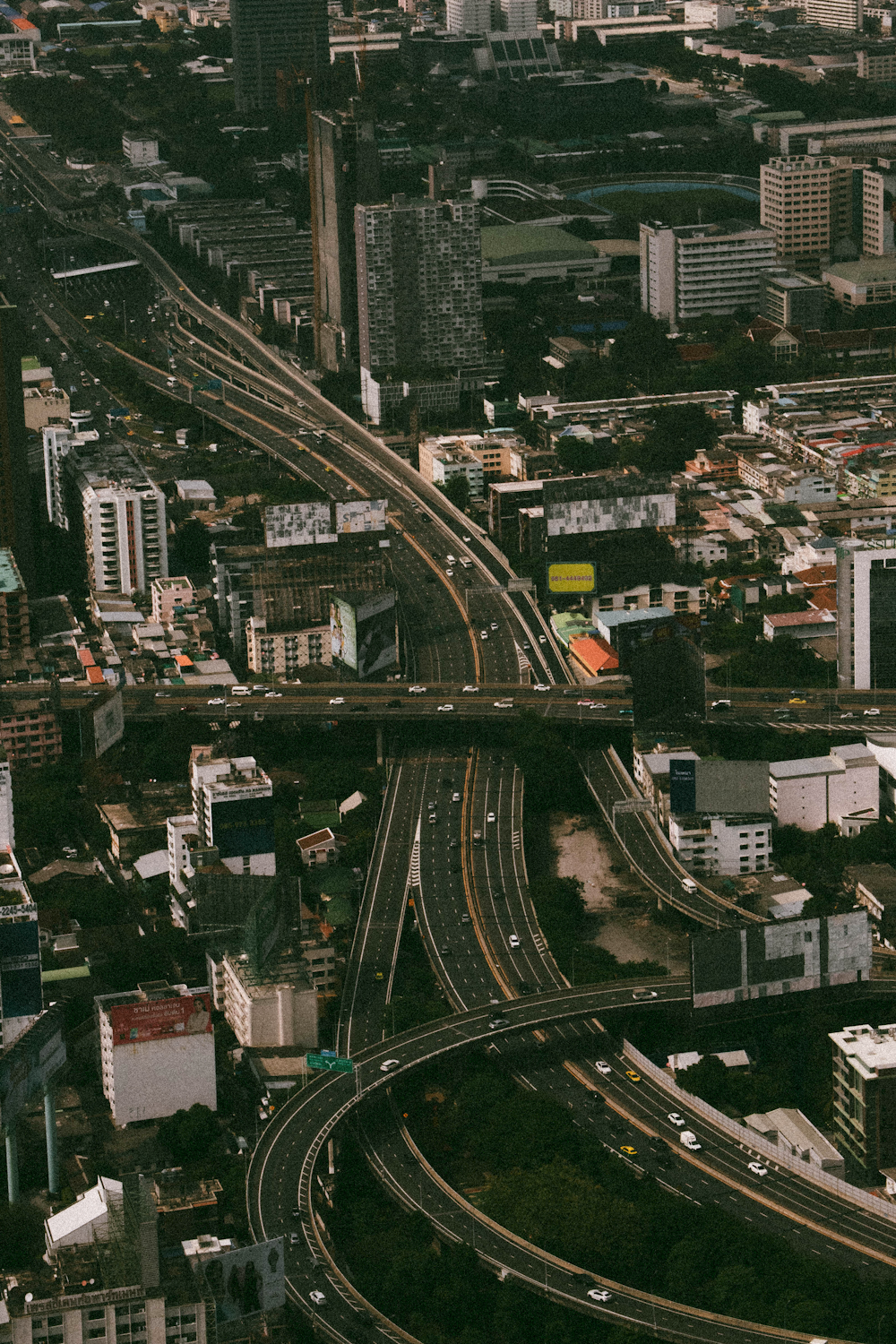 an aerial view of a city with a freeway