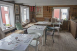 Charming shared living area with rustic furniture and warm lighting.