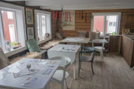 Interior of Wytchnienie with warm wooden furniture and soft beige tones