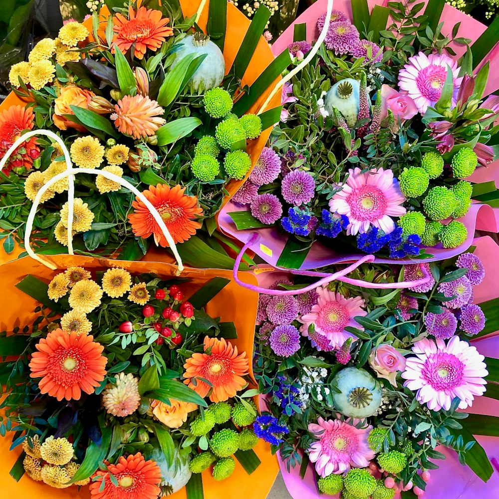 a bunch of flowers that are sitting on a table