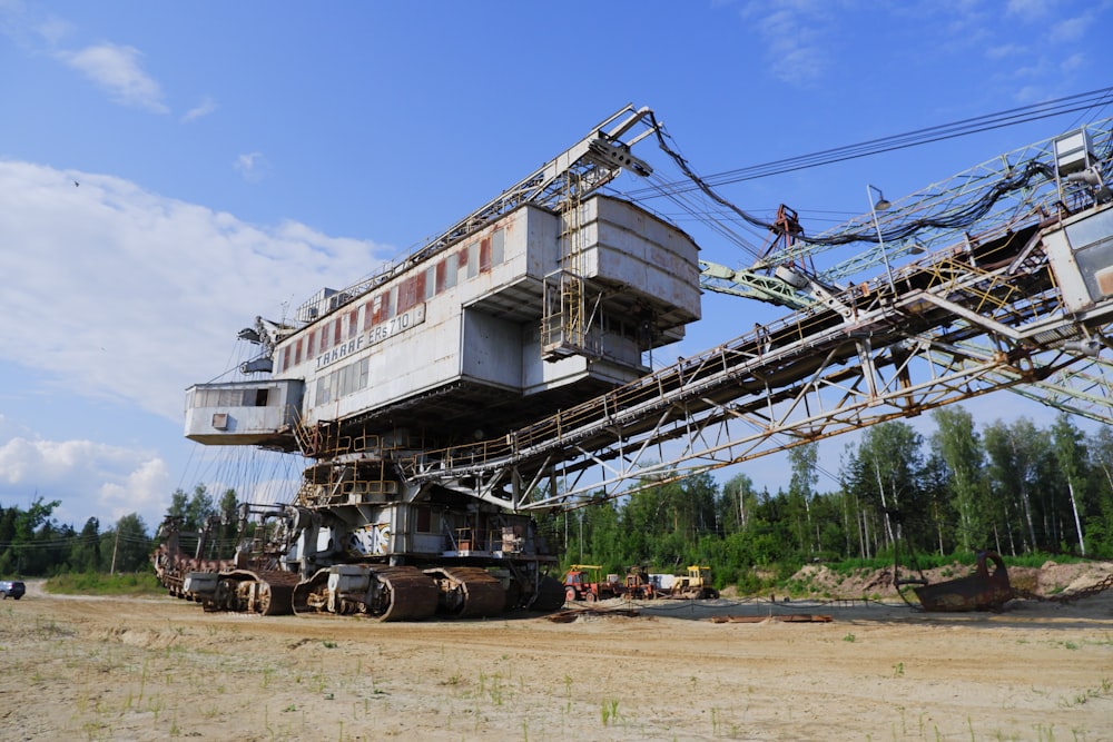 a train car sitting on top of a dirt field