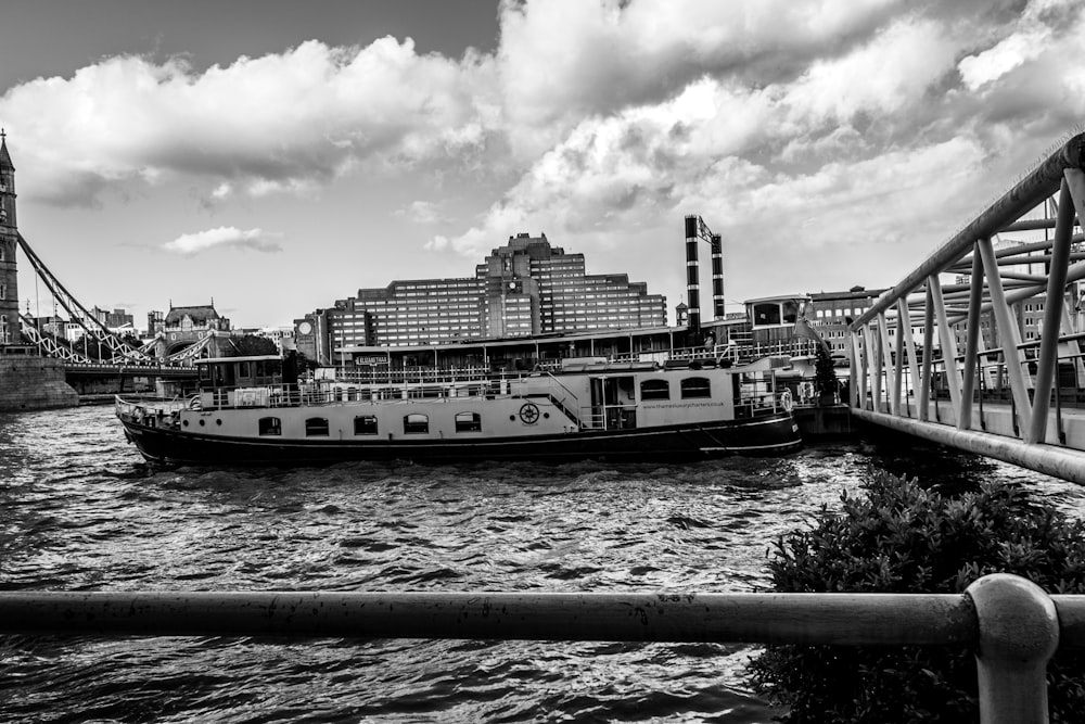 a black and white photo of a boat in the water