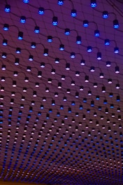 a ceiling with blue lights hanging from it