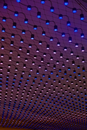 a ceiling with blue lights hanging from it