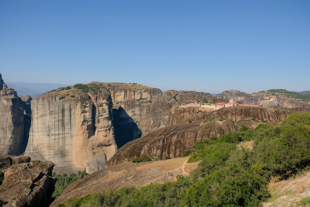 a scenic view of a mountain with a castle on top of it