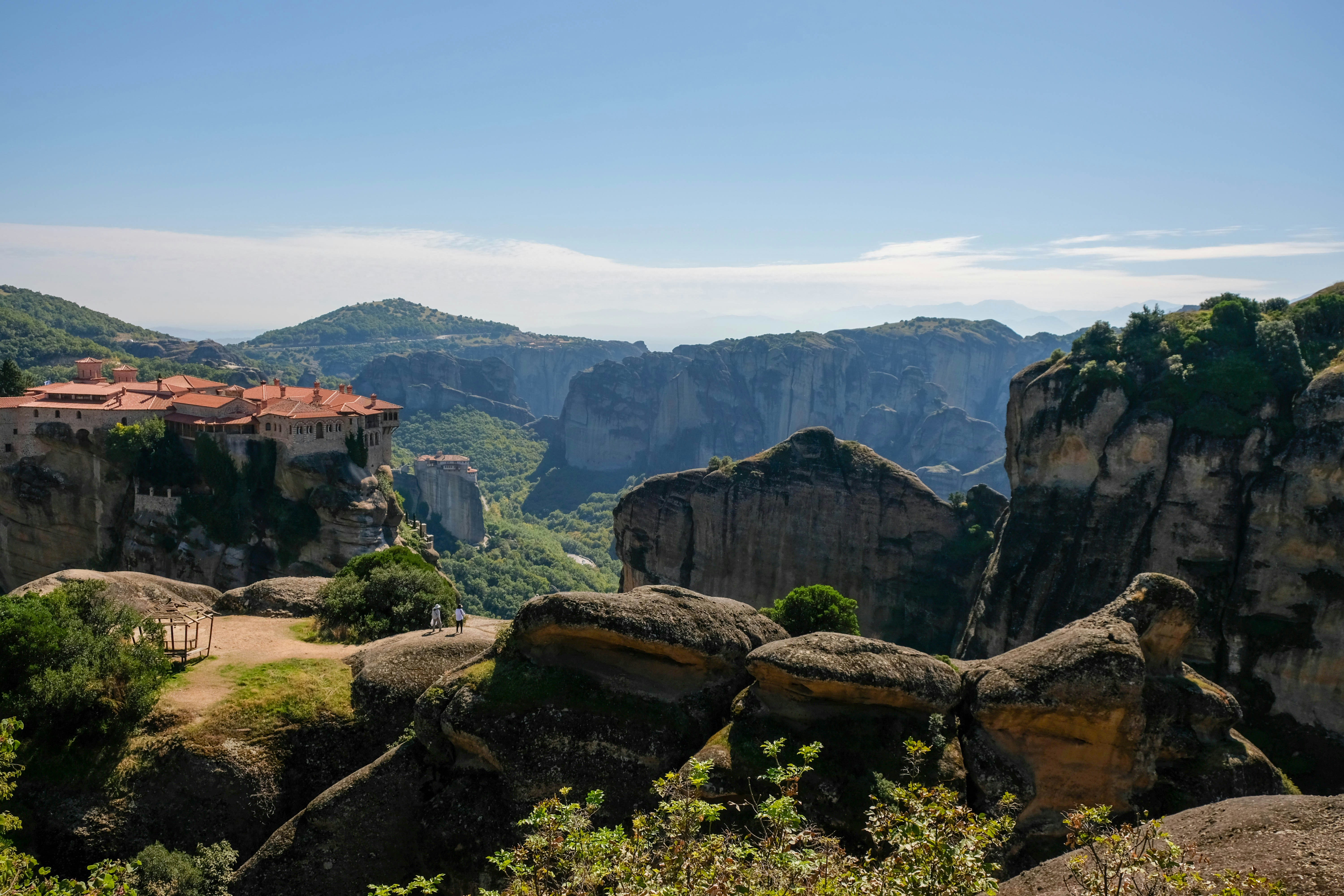 a scenic view of a mountain town in the distance