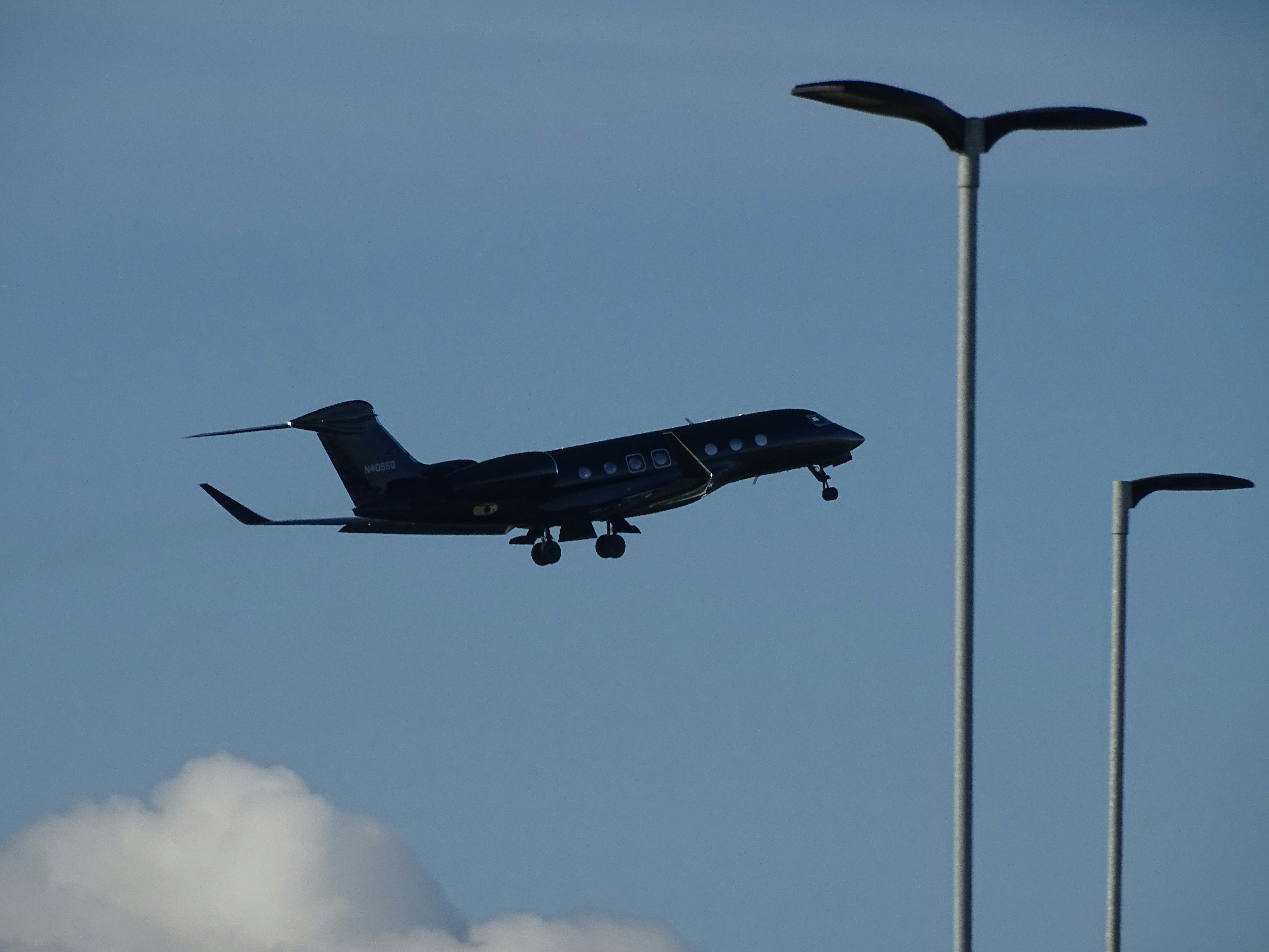 a small plane is flying low to the ground, GULFSTREAM AEROSPACE CORP plane GVI (G650ER) departing from London Luton Airport