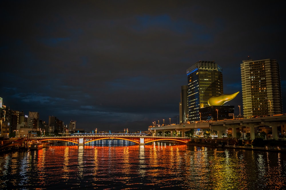 a bridge over a body of water at night