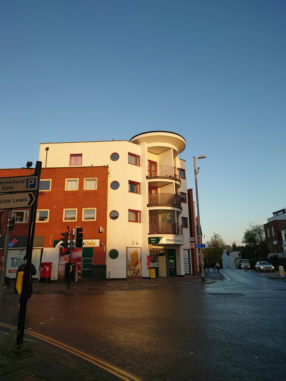 a street corner with a building on the corner