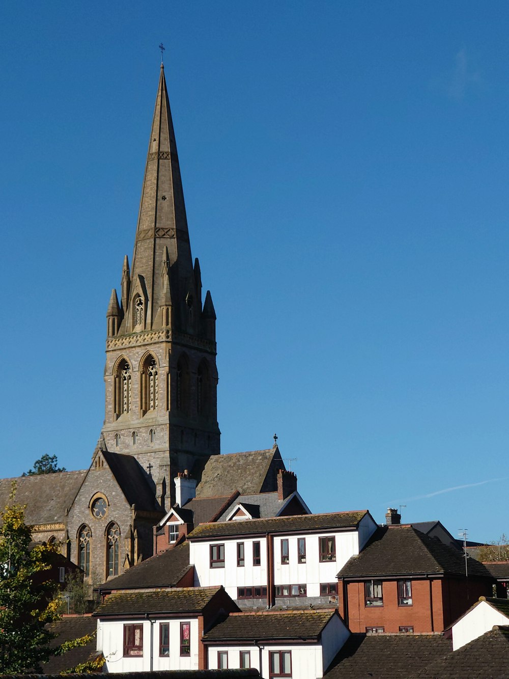 a church with a steeple on a clear day