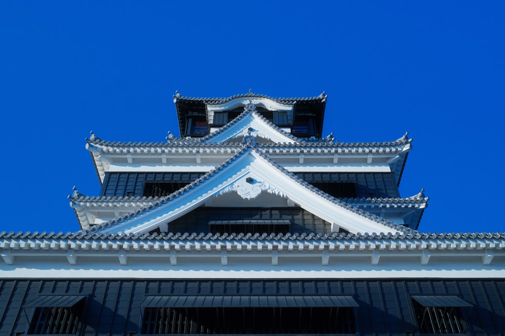 a tall building with a blue sky in the background